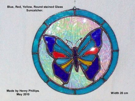 Blue Red Yellow butterfly on round backing