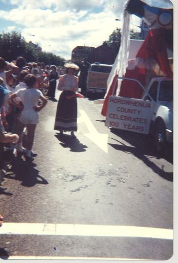 Women in period costume and champagne float