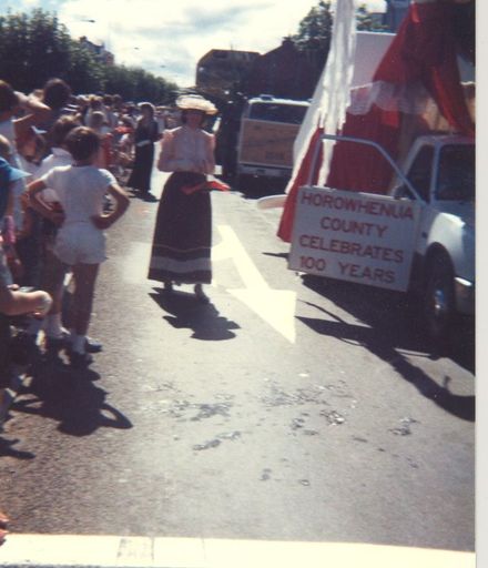 Women in period costume and champagne float