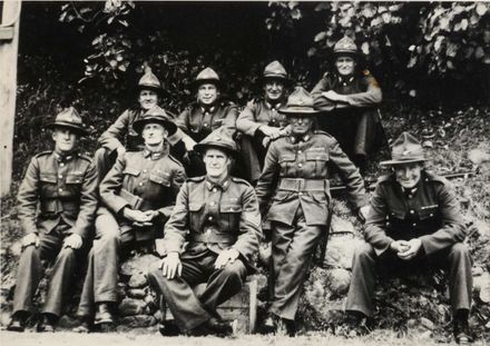 Tom Bell & 8 men (unidentified) in military uniform, WW II