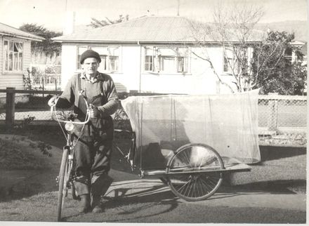 Man (unidentified) with bicycle & trailer with whitebait net