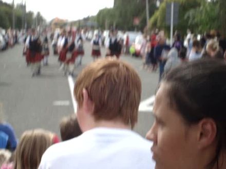 Pipe band with drums marching towards up in Levin Christmas Parade 2011 - Resource cover image