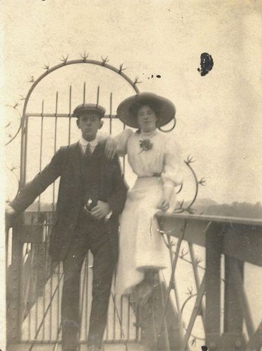 Young couple in front of an ornate gate. - Resource cover image
