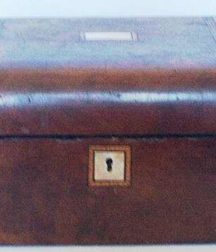 Walnut sewing box with inlaid design.