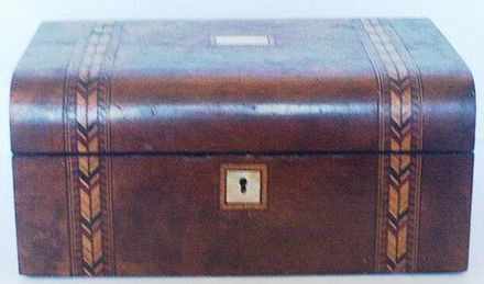 Walnut sewing box with inlaid design.