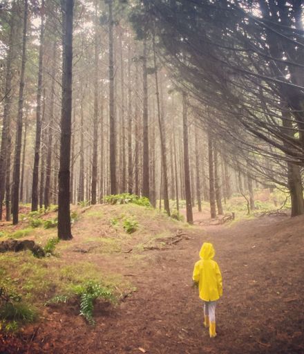 Girl in raincoat at Waitārere forest - #CaptureYourHorowhenua