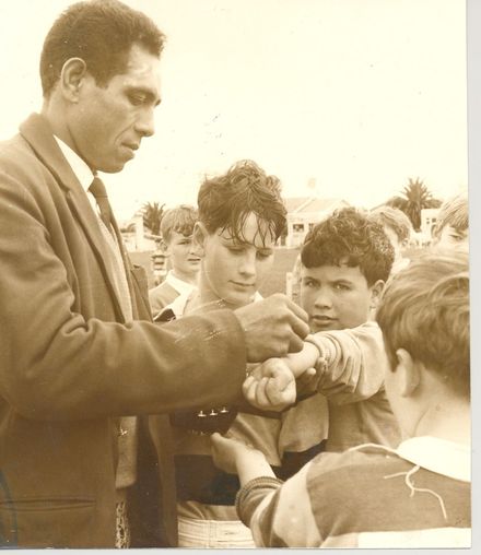 Mr Siaosi Selupe (Tongan Rugby prop) signs autographs