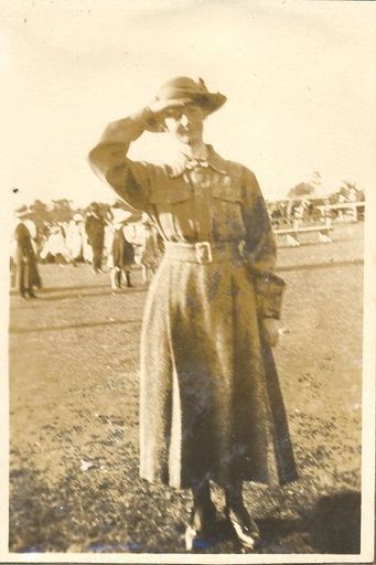 Woman in uniform, saluting
