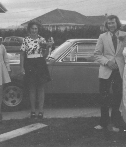 Unidentified bride & groom with 3 female onlookers, 1970's