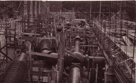 Pipe work in powerhouse during construction, 1922
