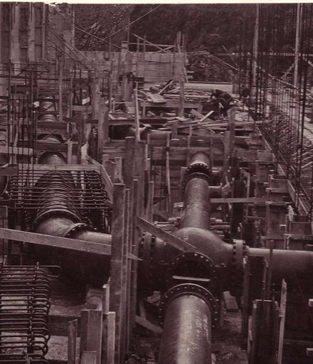 Pipe work in powerhouse during construction, 1922