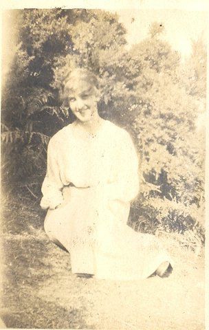 Young woman sitting on lawn. - Resource cover image