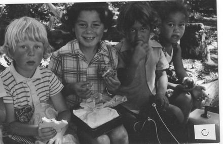 Children in bush having lunch