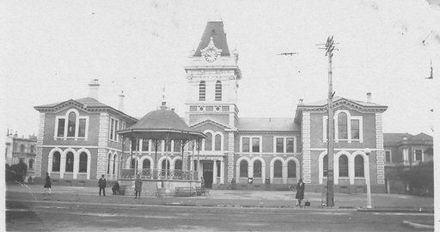 Unidentified large 2-storey public building with clock tower, 1927 or 1928