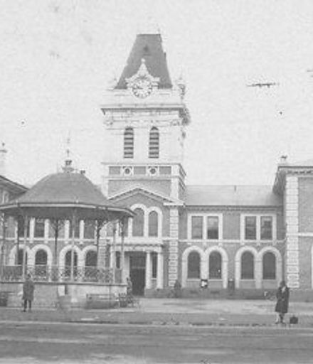 Unidentified large 2-storey public building with clock tower, 1927 or 1928