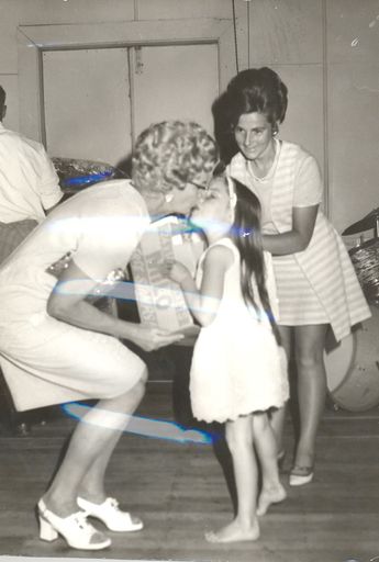 Two women & girl (unidentified) at function in hall - Resource cover image