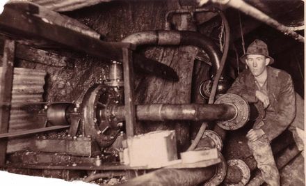 Man (unidentified) at waterpump in No.2 Tunnel, 3 May 1923