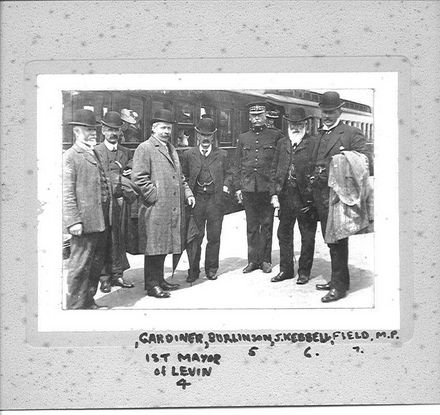 Local Dignitaries Alongside a Train