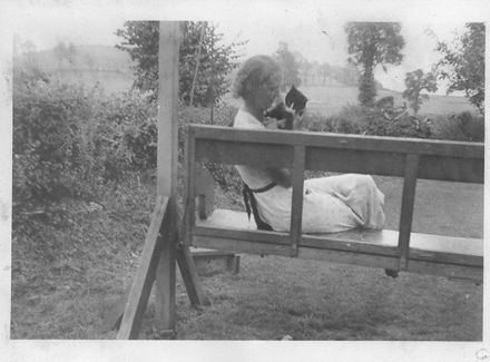Young woman on swingseat with cat at Babbacombe 1938