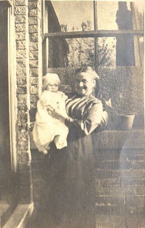 Grandmother (?) holding baby - Resource cover image