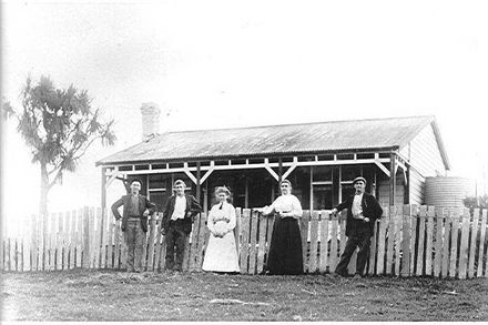 Brown Family in front of house, 1906