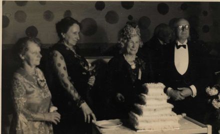 Miss Bowen & others with cake