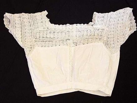 Camisole with crocheted lace yoke.