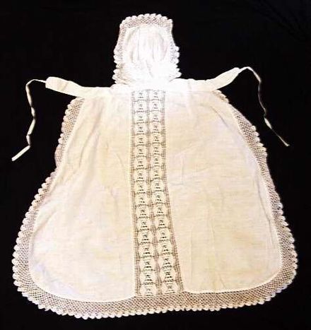Bibbed apron with crocheted panels.