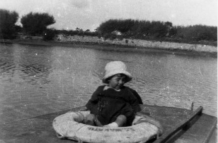 Small Child Sitting in Life-Ring of "SS Wakatu"