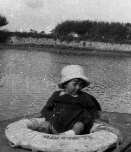 Small Child Sitting in Life-Ring of  "SS Wakatu"