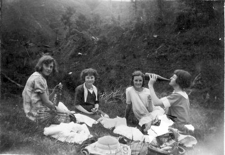 Four young women having picnic on Heights Road, early 1930's