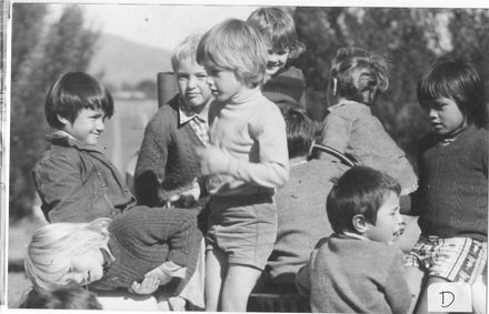 Children playing on 'merry-go-round'