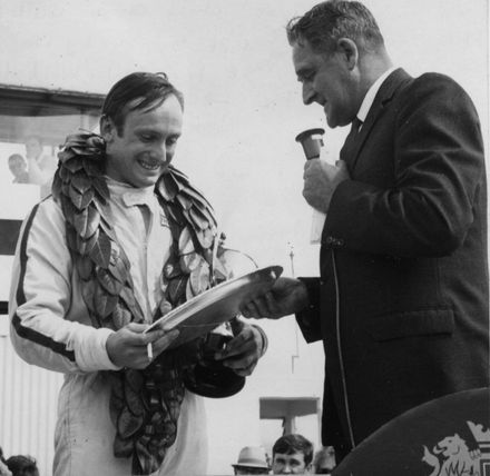 Mr Amon receives trophy from Mr McCready