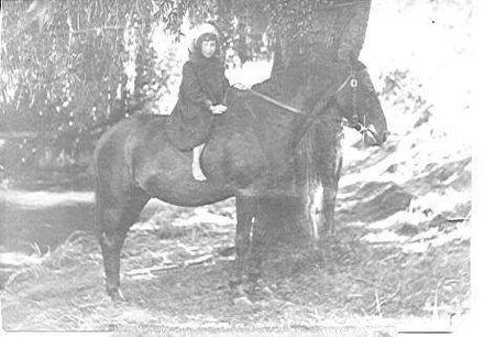Unidentified girl on Horseback