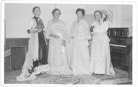 Wearing period gowns at Red Cross function
