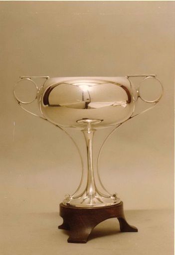 Trophy - Silver Cup (with handles) mounted on black base 'feet'