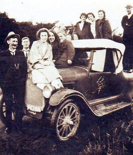 Members of Brown family and others on car, 4 a.m. New Year's morning, 1920's ?
