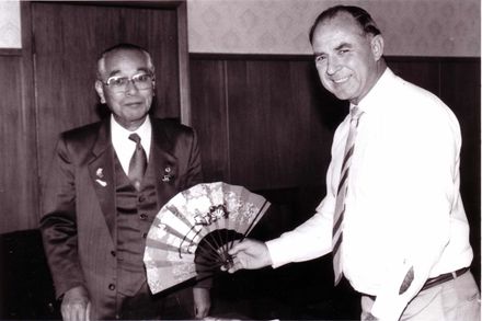 Mayor Tom Robinson Accepting Gift From Shimousa Visitor, 1995