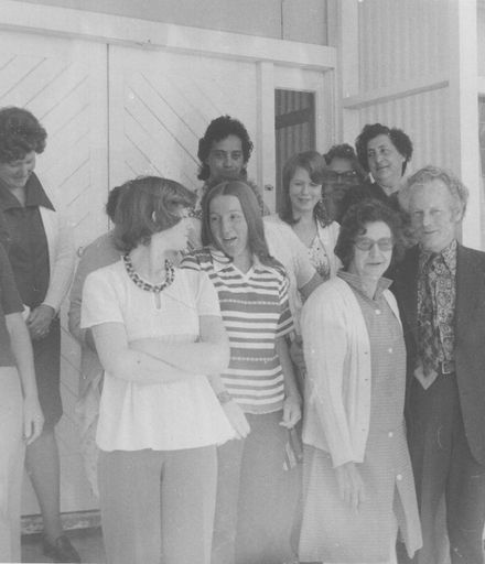 Another view of staff group - 14 women with Mr Foxton, 22 December 1977