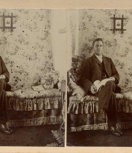 Mr Jas. (James) Hallam seated on divan with book in lap, Shannon, 1906