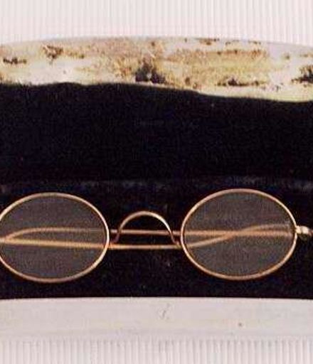 Eyeglasses in stainless steel case