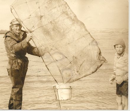 Mr Ransom & son (Colin or Derek) whitebaiting, Hokio Beach, 1969