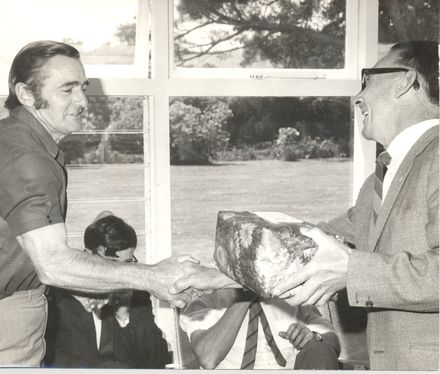 Presentation of gift with handshake