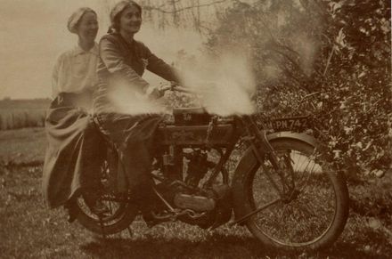 Margaret Law on motorcycle with woman (unidentified)