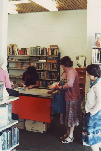 Librarian Mrs Pam Locke issuing books to Mrs Joan Mark, 1981