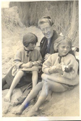 Grandmother with 2 children at the beach