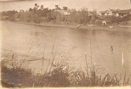 Photo taken looking across a stream to houses. - Resource cover image