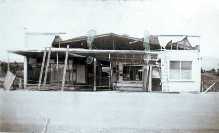 Building (housing 3 shops) damaged by severe winds, 1933
