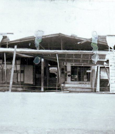 Building (housing 3 shops) damaged by severe winds, 1933
