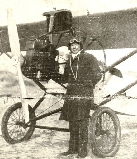 Jack Butler standing in front of his plane